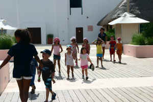 Mini-Club walking through Cllub Med Cancun Yucatan